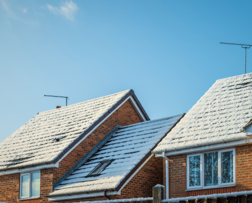 Snow covered new built house roof